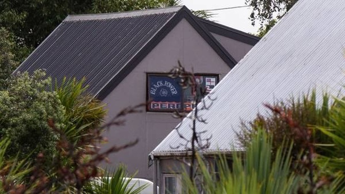 Black Power flags in the window of an Ōtāhuhu property allegedly being occupied illegally. Photo / Leon Menzies