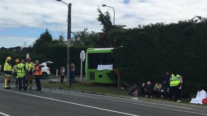 A car failed to give way at an intersection, with a commercial bus swerving into a hedge to avoid it.
