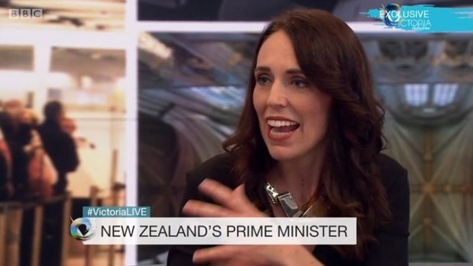 The PM says she will leave partner Clarke Gayford go through "the pain and torture" of having to agonise about the question of popping the question himself. (Photo / BBC)