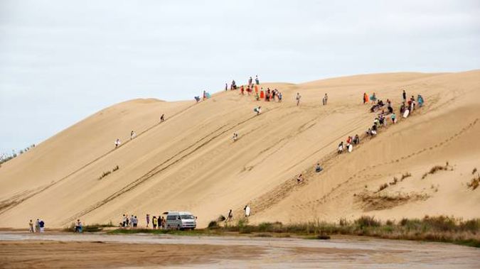 The sand dunes at Te Paki are a popular attraction for tourists who are encouraged to ride boards down the slopes. Photo / File