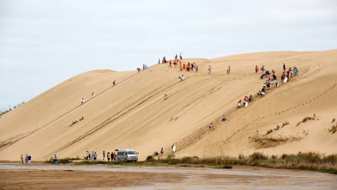 The sand dunes at Te Paki are a popular attraction for tourists who are encouraged to ride boards down the slopes. Photo / File