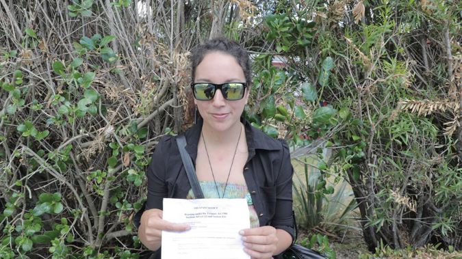 Josie Butler with her trespass notice at Te Tii Waitangi marae. (Photo / Michael Craig)