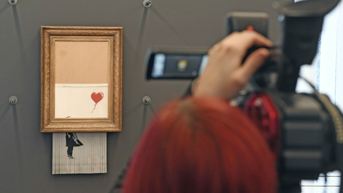 'Love is in the Bin' has returned to the art world. (Photo / AP)