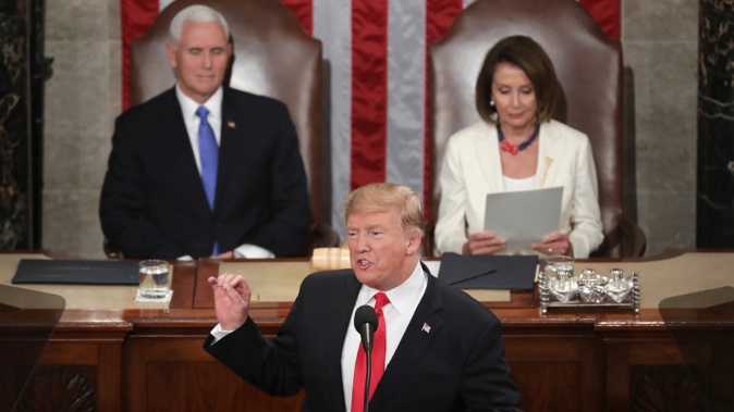 President Donald Trump, with Speaker Nancy Pelosi and Vice President Mike Pence looking on, delivers the State of the Union address. Photo / Getty Images