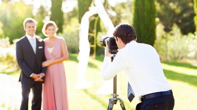 A Christchurch woman says a photographer who objected to her ad seeking a student to take her wedding photos for free urged people to whack her. Photo / Getty Images
