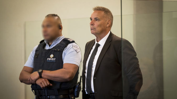 Former top Northland police officer Kevin Burke stands in the dock at the Auckland High Court to face sex charges. (Photo / Dean Purcell)