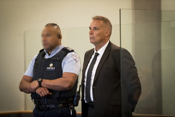 Former top Northland police officer Kevin Burke stands in the dock at the Auckland High Court to face sex charges. (Photo / Dean Purcell)
