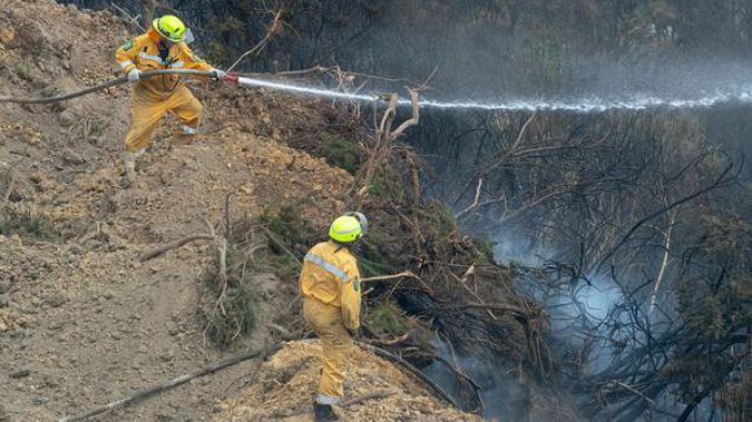 A risk of flare-ups is keeping people out of their homes for another day. (Photo / NZ Herald)