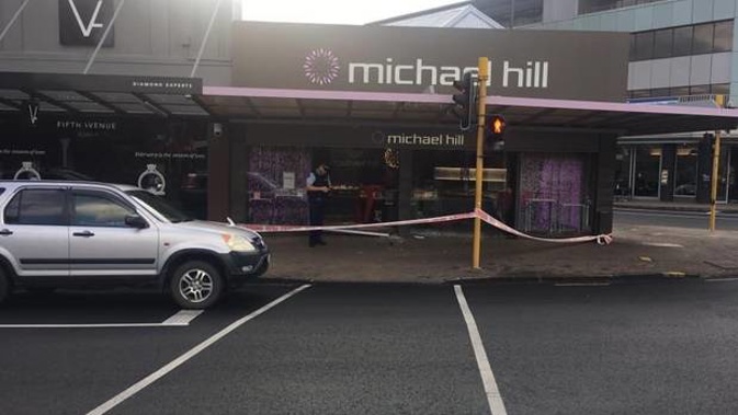 Two vehicles carrying four people were involved in the ram raid on the store in Takapuna, Auckland this morning. (Photo / Adam Bennett)