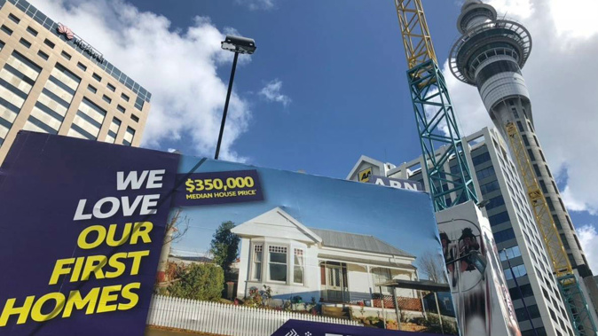 The billboards have popped up with the slogan of "We love our first homes". (Photo / NZ Herald)