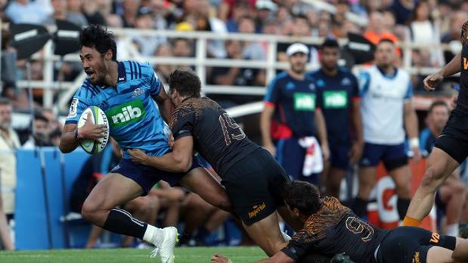 Melani Nanai of the Blues is tackled by Juan Cruz Mallia and Tomas Cubelli of the Jaguares in BUenos Aires. Photo / Getty