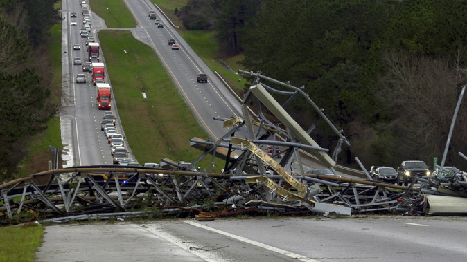 A fallen cell tower in Alabama is just some of the structural damage. (Photo / AP)