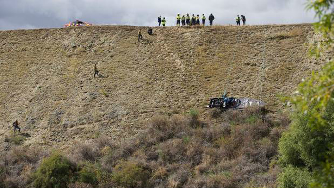 Emergency services at the scene of the crash on the Clutha River near Wanaka. Photo / James Allan