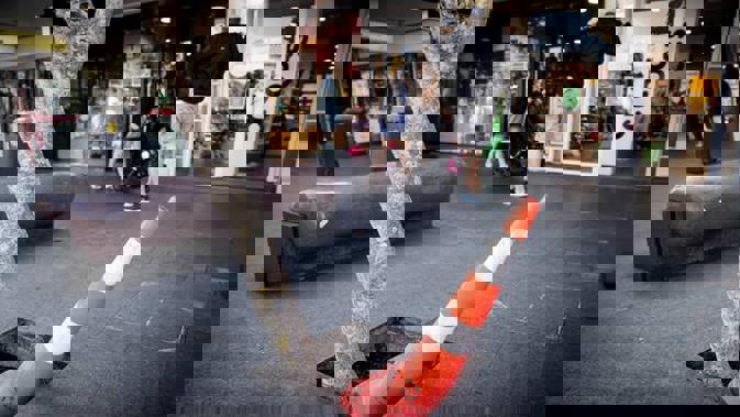 Road cones have been placed in open tree surrounds along Newmarket's Broadway after an elderly man was critically injured when he fell in one. (Photo / Dean Purcell)