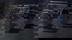 Dashcam footage shows a speeding car swerving out of a bus lane and smashing into multiple vehicles on Auckland's SH20 motorway. (Video: Supplied by Ben Comemadang)