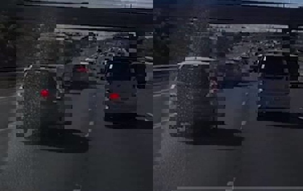 Dashcam footage shows a speeding car swerving out of a bus lane and smashing into multiple vehicles on Auckland's SH20 motorway. (Video: Supplied by Ben Comemadang)