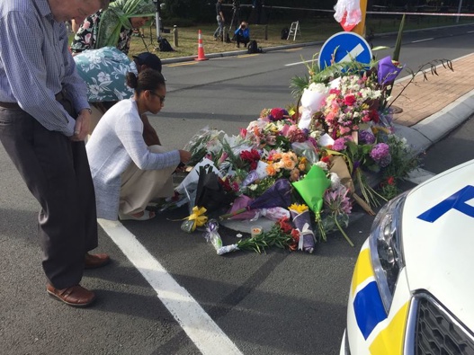 Christchurch residents laying flowers outside the Al Noor Mosque cordon. Photo / Amber Allott.