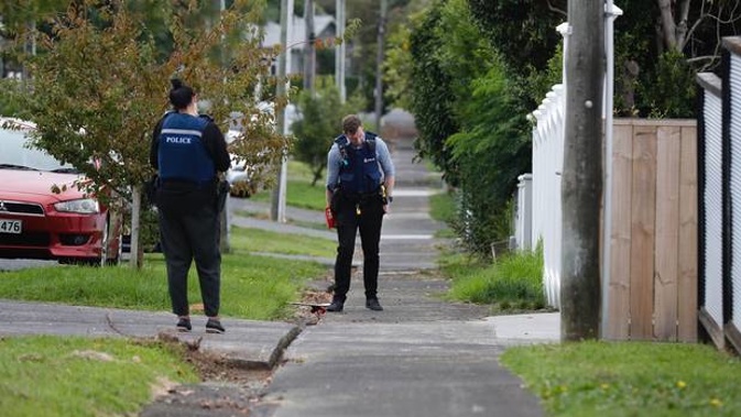 Police at the scene on Cameron St, Onehunga, where an out of control party resulted in a stabbing last night. (Photo / Dean Purcell)