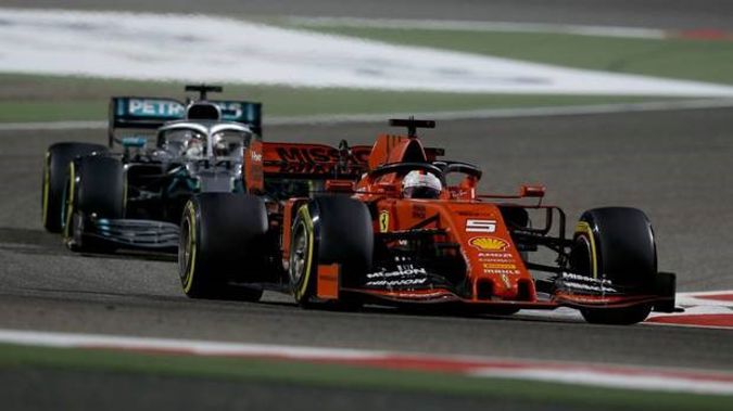 Sebastian Vettel of Germany driving the Scuderia Ferrari SF90 leads Lewis Hamilton of Great Britain driving the Mercedes AMG Petronas F1 Team Mercedes W10 during the Bahrain Grand Prix. Photo / Getty.