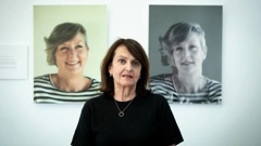 Sweet Louise chief executive Philippa Reed stands in front of images of Anna Southern, who was one of 100 members if the support group who have died since last October. Photo / Dean Purcell