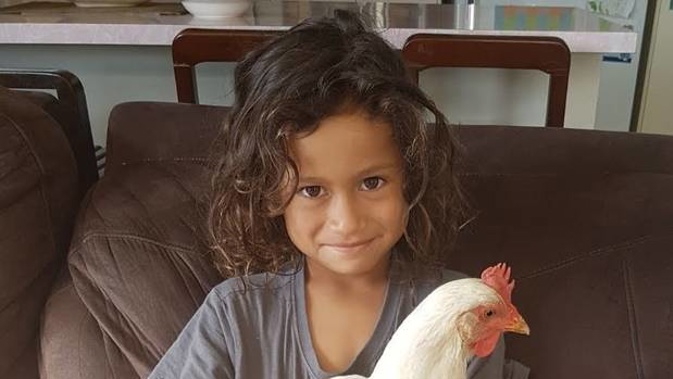 Eight-year-old Tohe Tatai with his pet chicken, Cheeka. Photo / supplied