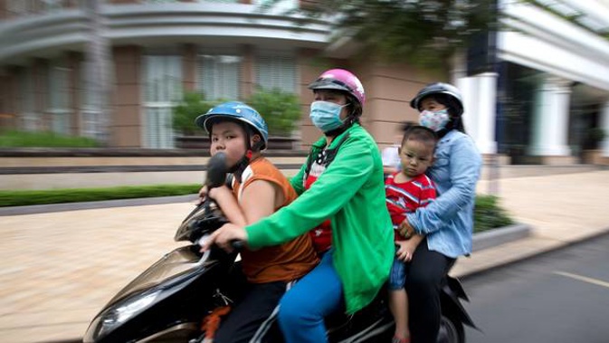 A family make their way around the city on a scooter in Ho Chi Minh City, Vietnam. Photo / File, supplied