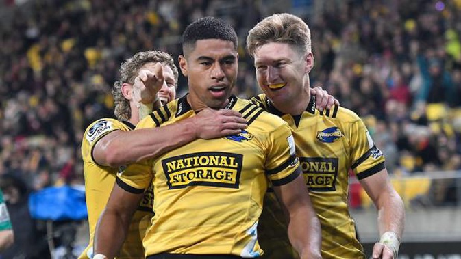 Salesi Rayasi of the Hurricanes celebrates his try with Jordie Barrett and Richard Judd. (Photo / Photosport)