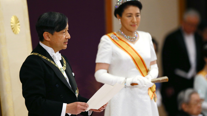 Emperor Naruhito, accompanied by new Empress Masako, makes his first speech in his new role. (Photo / AP)