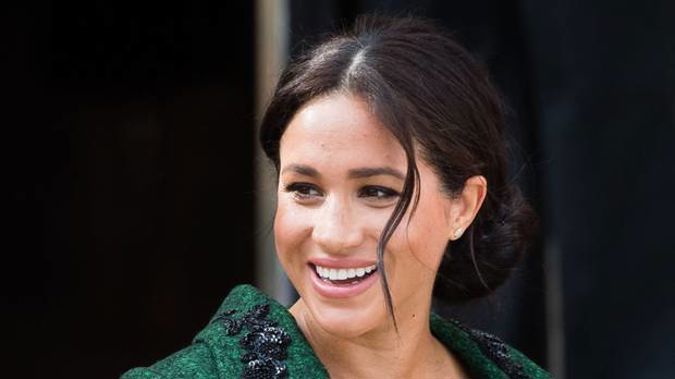 Despite her baby being overdue, sources insist Meghan Markle is "relaxed and positive". (Photo / Getty)