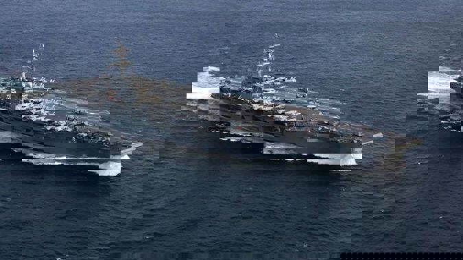 An aircraft carrier is one of many means the US are using to "send a message to Iran". (Photo / Supplied)