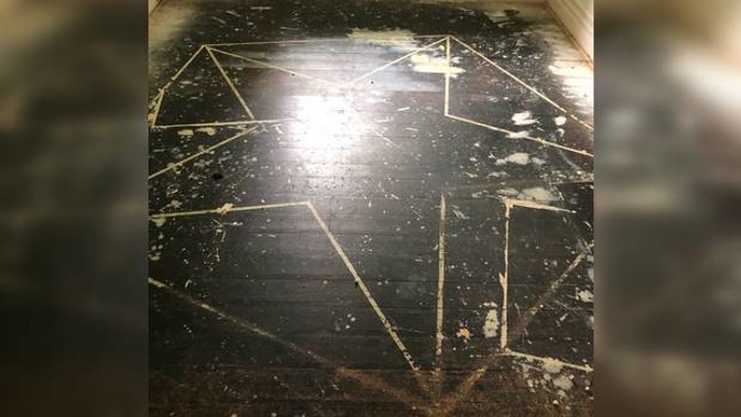 The pentagram was discovered when they were replacing the carpet. (Photo / Supplied)