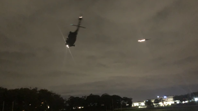 The two helicopters landed on Auckland Domain for a short time before leaving. (Photo / Supplied)