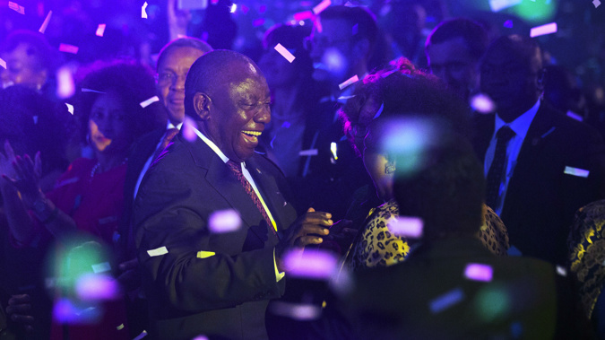 Cyril Ramaphosa celebrates his party's election victory. (Photo / AP)