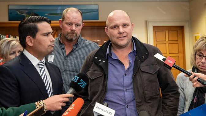 Logan Porteous, centre, with National leader Simon Bridges, and others who have lost family to drugged drivers, met at Parliament today. (Photo / Mark Mitchell)