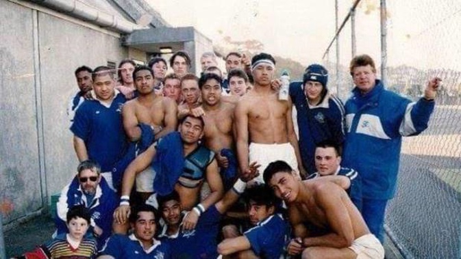 Pua Magasiva, sitting on the ground third from right, in front of Jerry Collins, pictured in the St Patrick's College 1st XV of 1998. (Photo / Facebook)