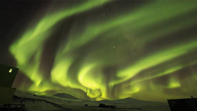 Mt Erebus below with the Milky Way above the aurora australis. (Photo / Jonny Harrison)