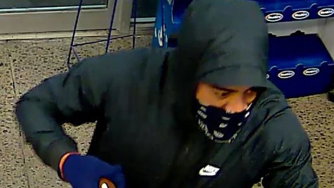 Police are appealing for information after a Christchurch petrol station was robbed at gunpoint, allegedly by this man. Photo / NZ Police