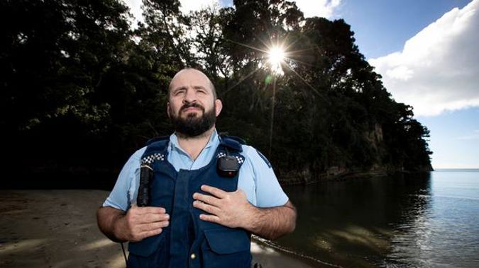 Constable Roger Dustow at Orewa Beach where he was involved in the May 12 rescue. Photo / Dean Purcell