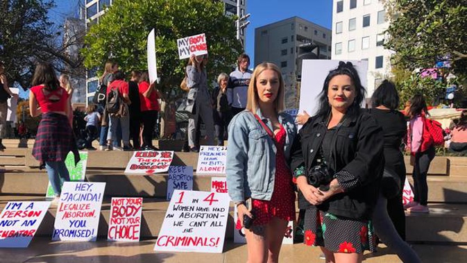 Protest organisers Kayla Bunce, left, and Tegan Tinsley, right, at the rally in Aotea Suqare. Photo / Alice Peacock