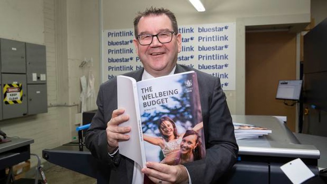 Finance Minister Grant Robertson during his visit to PrintLink in Petone to view copies of his 2019 The Wellbeing Budget hot off the press. Photo / Mark Mitchell