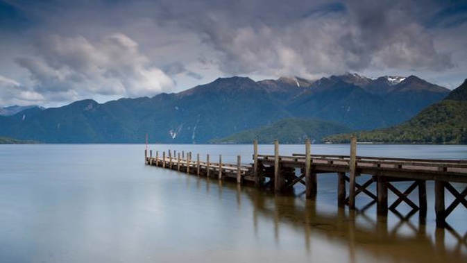 Lake Hauroko is a 30km-long, S-shaped lake in Fiordland National Park. Photo / Getty Images