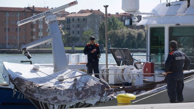Italian Coast Guard officers inspect the tourist boat that was struck by a cruise ship in Venice. Photo / AP