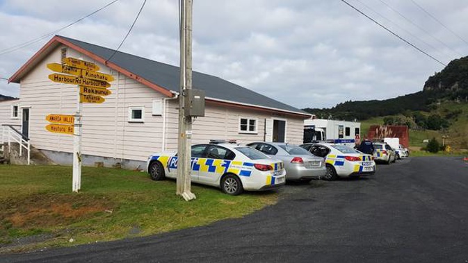 Police have set up their operation in the Hauturu School hall on Harbour Rd after an incident left one person dead and three others injured. Photo / Dean Taylor