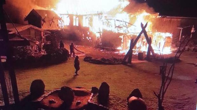 Firefighters battle the massive blaze at Tapu Te Ranga Marae. (Photo / Twitter)