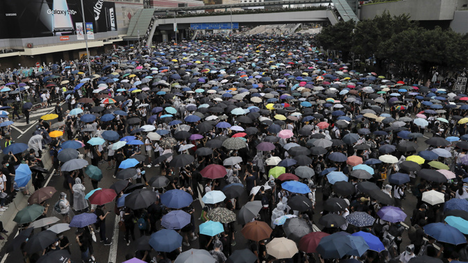 Thousands of protesters gather in Hong Kong against the controversial bill. (Photo / AP)