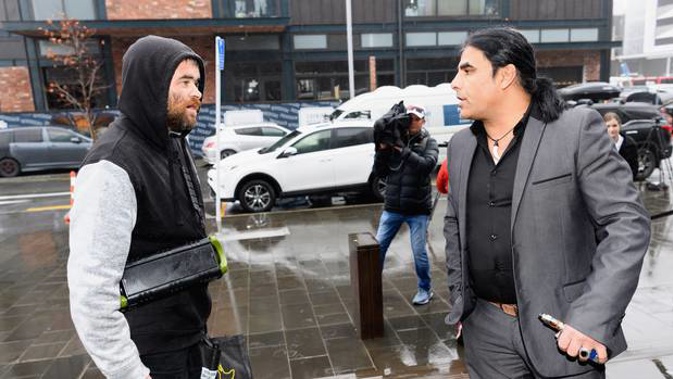 Man plays Nazi music and makes racist remarks to mosque victim Abdul Aziz outside of Christchurch High Court. (Photo / Getty Images)