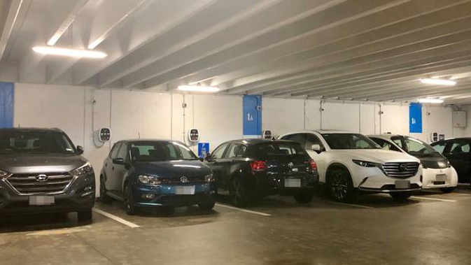Petrol-powered cars block electric vehicle charging stations in the Fanshawe St car park. The blue VW Polo's driver - a repeat offender - does contract work for Auckland Transport. (Photo / Supplied)