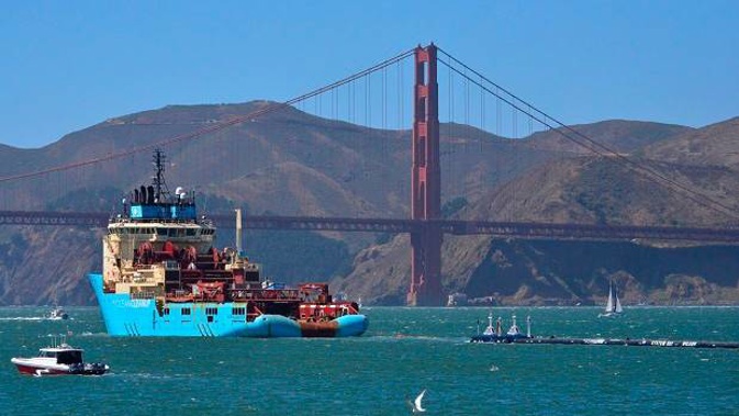 The buoyant trash-collecting device toward the Golden Gate Bridge in San Francisco en route to the Pacific Ocean. (File photo / AP)