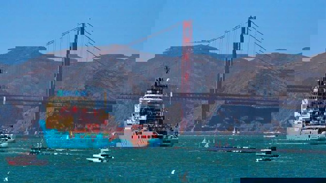 The buoyant trash-collecting device toward the Golden Gate Bridge in San Francisco en route to the Pacific Ocean. (File photo / AP)