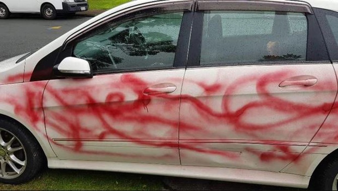 A West Auckland family have been repeatedly harassed - and in one incident their car was graffitied. Photo / supplied